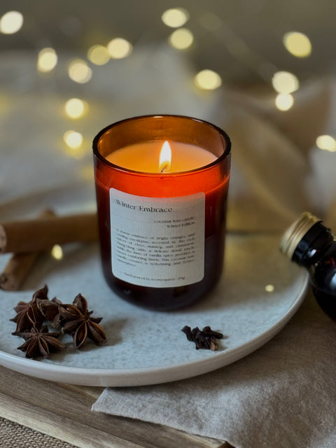 Winter Embrace candle by Aroma Quartz — kraft paper box packaging on wooden surface