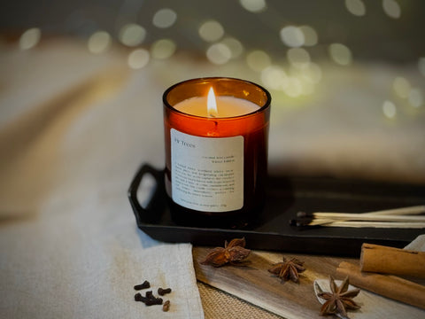 Fir Trees — Natural Wax Refillable Candle by Aroma Quartz — styled on woven mat with botanical props