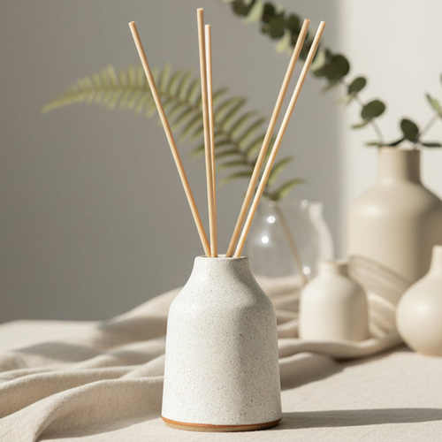 'Frosted Oat' Refillable Ceramic Diffuser by Aroma Quartz — refillable ceramic diffuser on neutral background