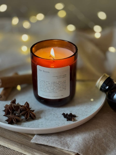 Fir Trees candle by Aroma Quartz — kraft paper box packaging on wooden surface