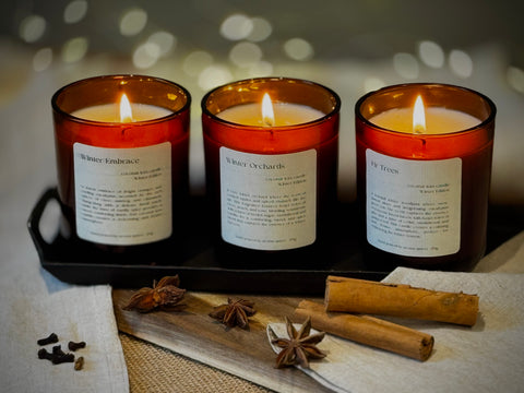 Winter Candle Trio Bundle + Free Exclusive Wax Melts candle by Aroma Quartz — kraft paper box packaging on wooden surface