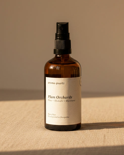 Plum Orchards room spray by Aroma Quartz — 100ml glass bottle with cream label