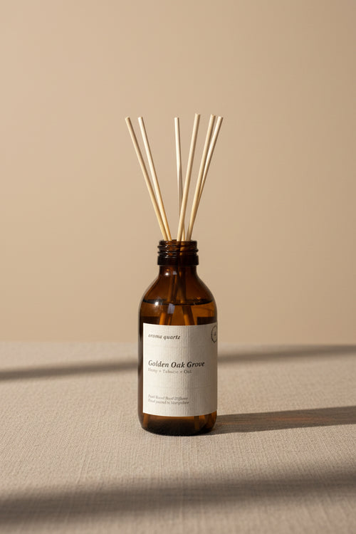 Golden Oak Grove reed diffuser by Aroma Quartz — brown glass bottle with wooden reeds