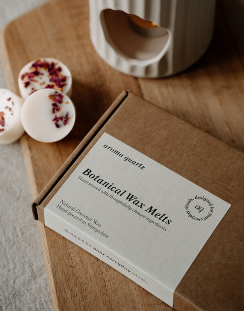 Box of Botanical Wax Melts with a label on a wooden surface